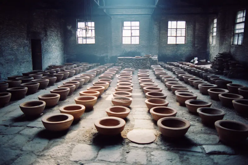 Clay fermentation jars buried in the floor of a Fenjiu workshop, Shanxi
