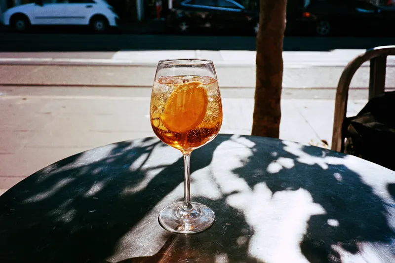 Shaoxing Spritz: amber Shaoxing wine spritz with ice and orange in a wine glass