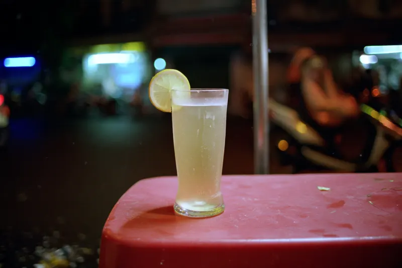 Ginger Lemon Shandy: cloudy beer and lemonade with lemon and ginger in a beer glass
