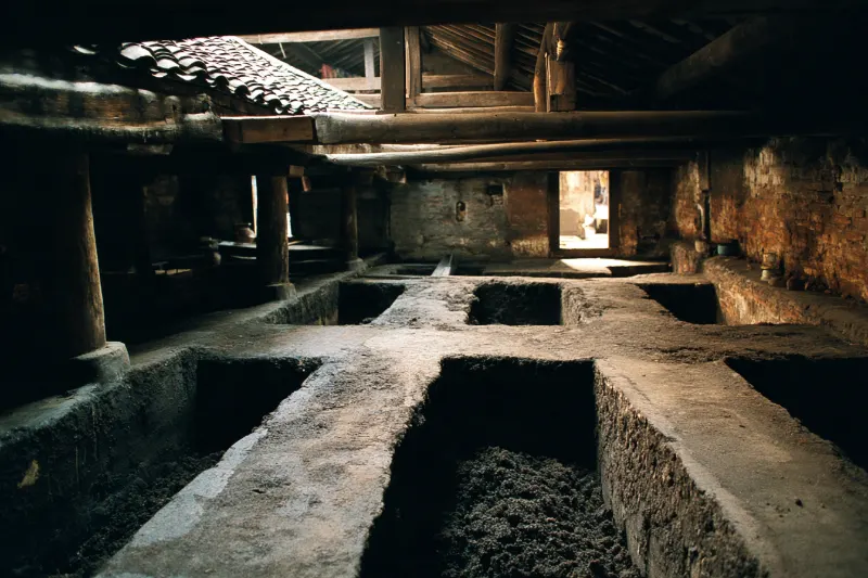 Old mud fermentation pits in a baijiu workshop in Luzhou, Sichuan